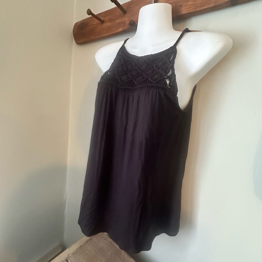 Maurices Black sleeveless top with a crocheted yoke. New with tags